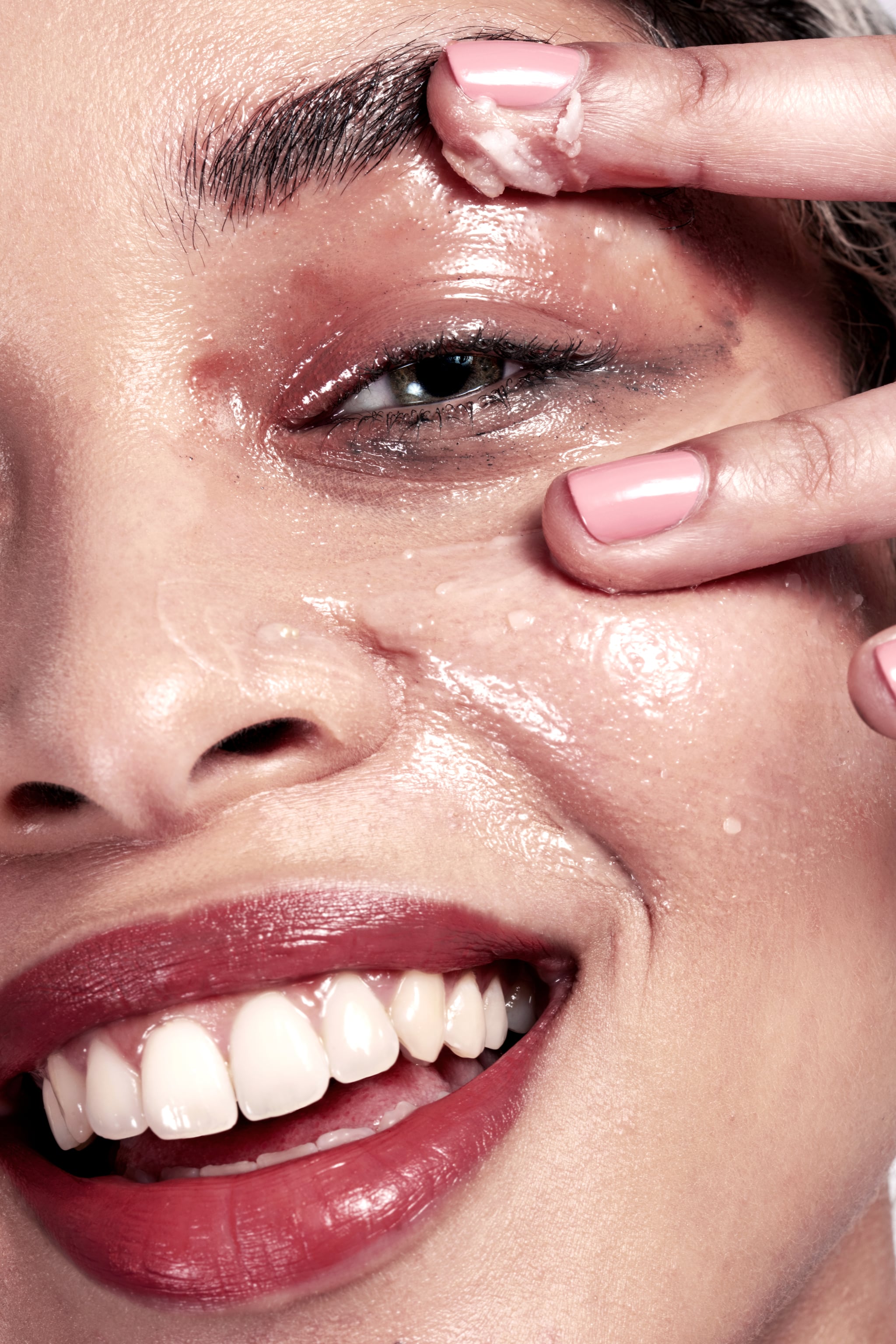 Woman cleansing her skin