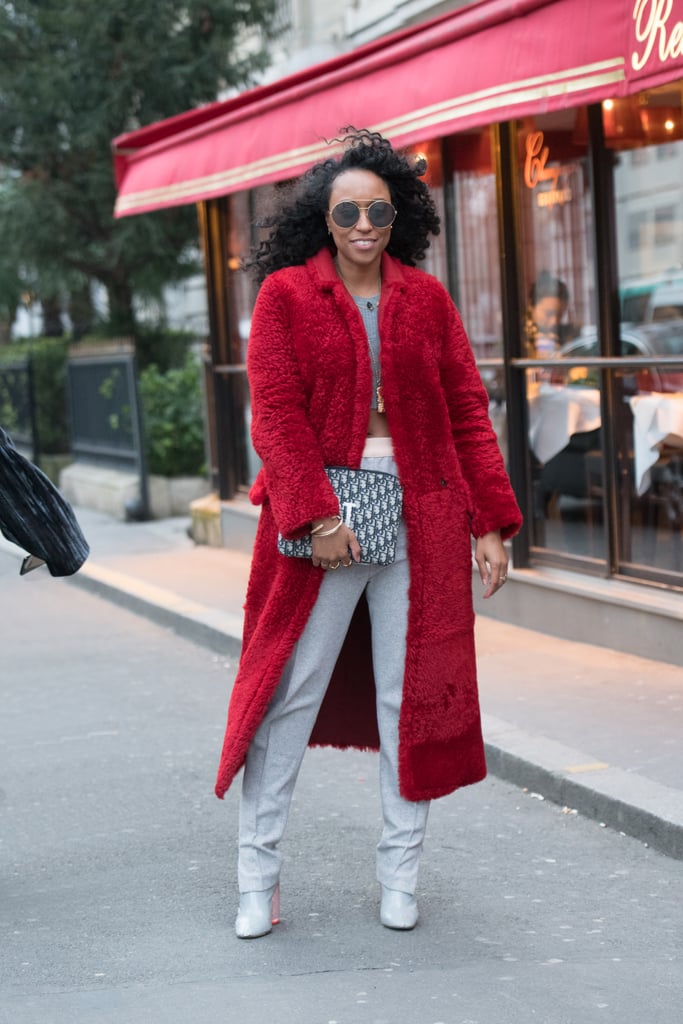 Take your cozy layer to the next level by opting for red outerwear instead of classic black, brown, or navy.