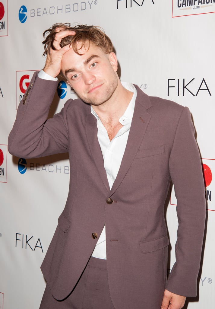 Despite having shaved half his head, Rob still had enough hair to run his fingers through at a Beverly Hills event in November 2014.