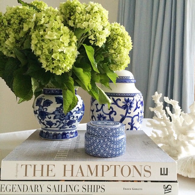 Stack your favorite flowers on your favorite coffee table books to add some dimension.
Source: Instagram user chiccoastalliving