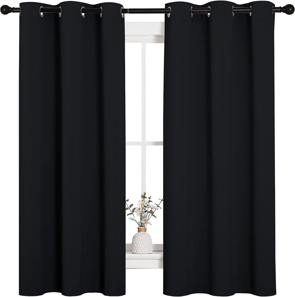 Nicetown Pitch Black Solid Thermal Insulated Grommet Blackout Curtains ($10, originally $29)
If light's seeping in through your window as you're trying to go to sleep, you're bound to have some trouble. These are the number one bestseller among Amazon's window curtains, with a triple-weave blackout fabric that impedes light and balances room temp. Choose from several colors.