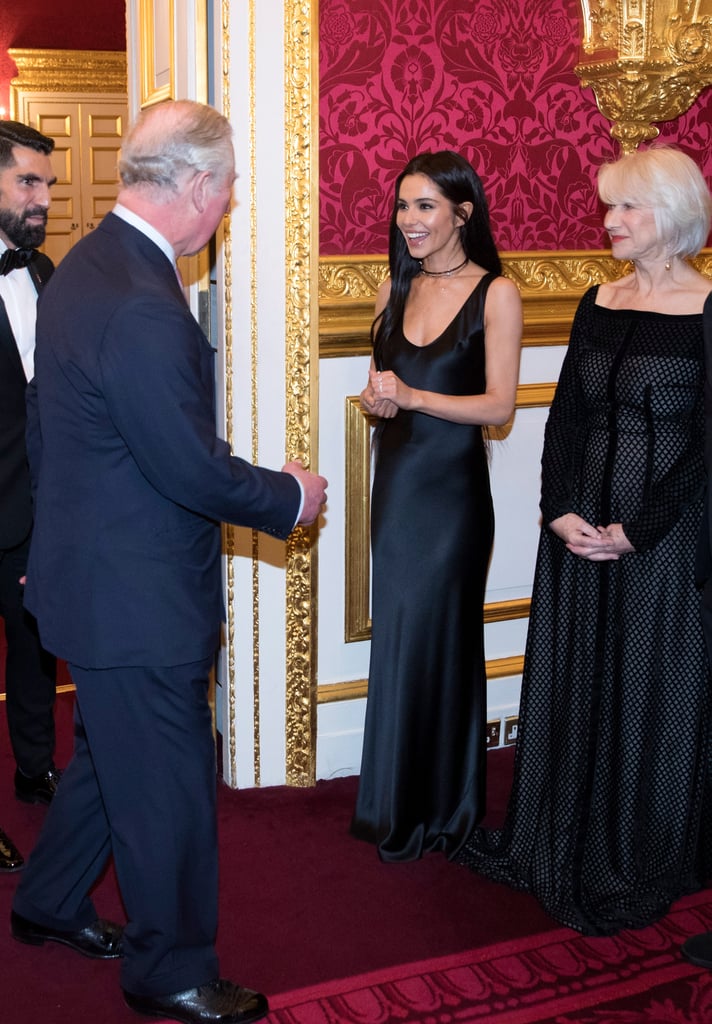 Cheryl wore a simple black satin sheath dress to mingle with Prince Charles and Dame Helen Mirren at a Prince's Trust event in February 2018.
