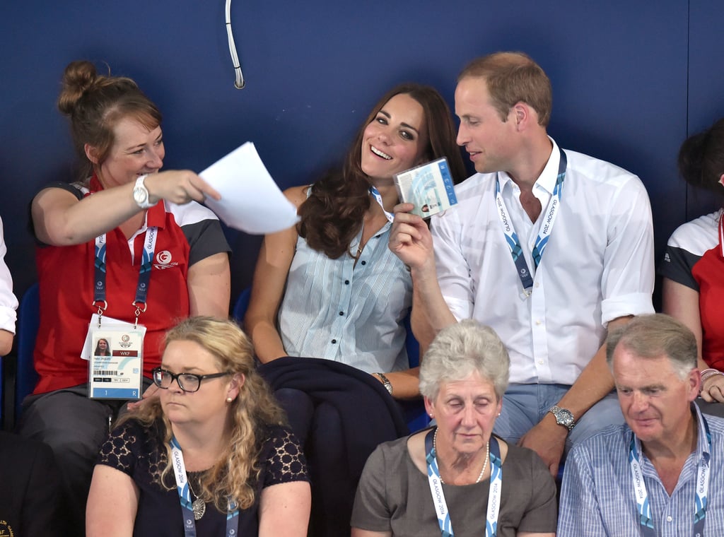 On Monday, William playfully used Kate's badge as a fan.