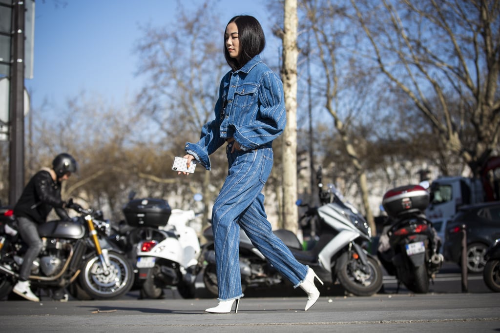 White stiletto booties are an edgy accent to a denim set.