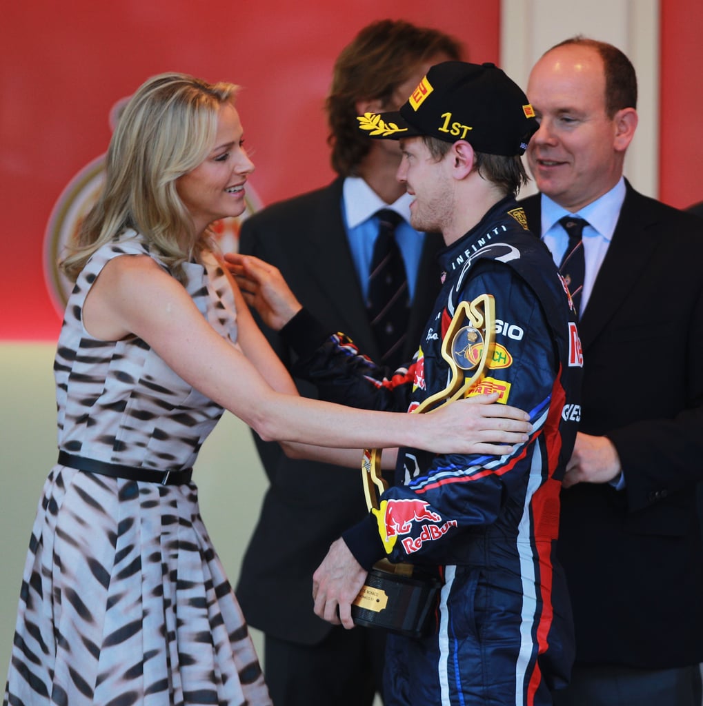 Sebastian Vettel of Germany received the winner's trophy from Prince Albert II of Monaco and his then-girlfriend, Charlene Wittstock, in May 2011. 
Source: Getty / Paul Gilham