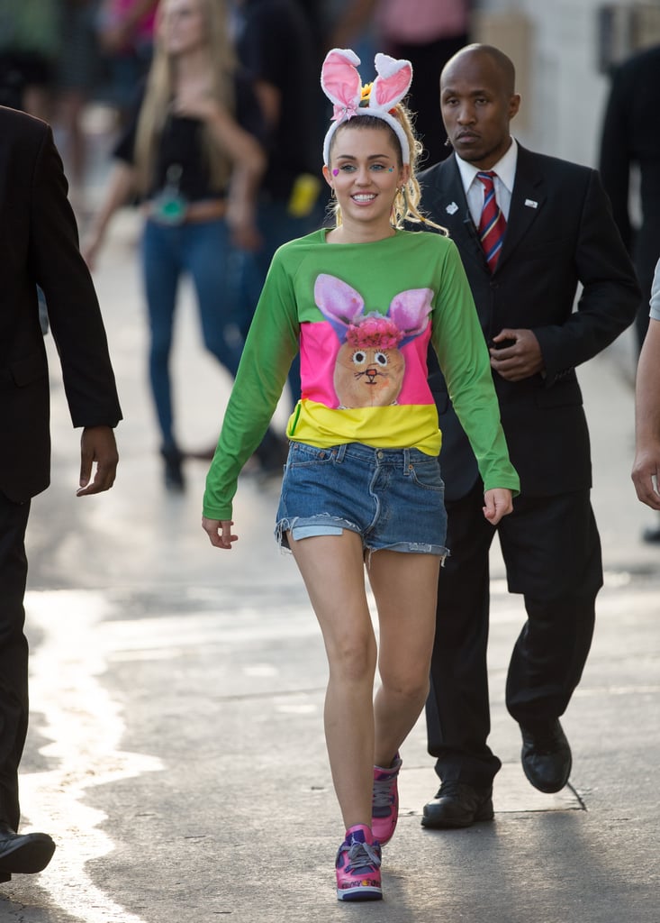 Miley accessorized her bunny look as anyone would: with a pair of pink ears and flashy purple and pink Nike Jordan sneakers.
