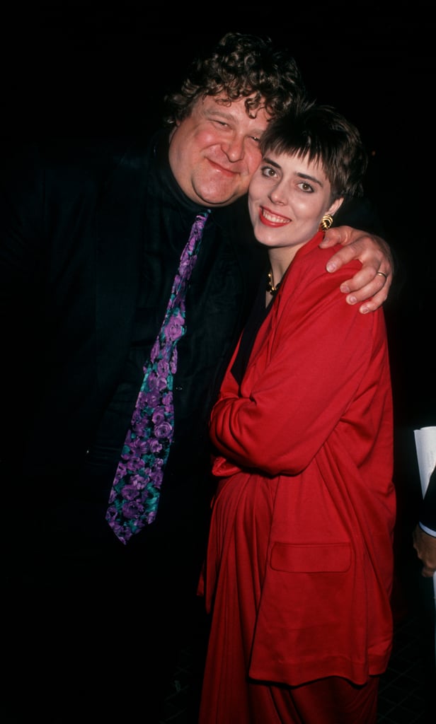 John wrapped his arms around his wife at the 1991 premiere of Stella at the Westwood Avco Theater in Westwood, CA.