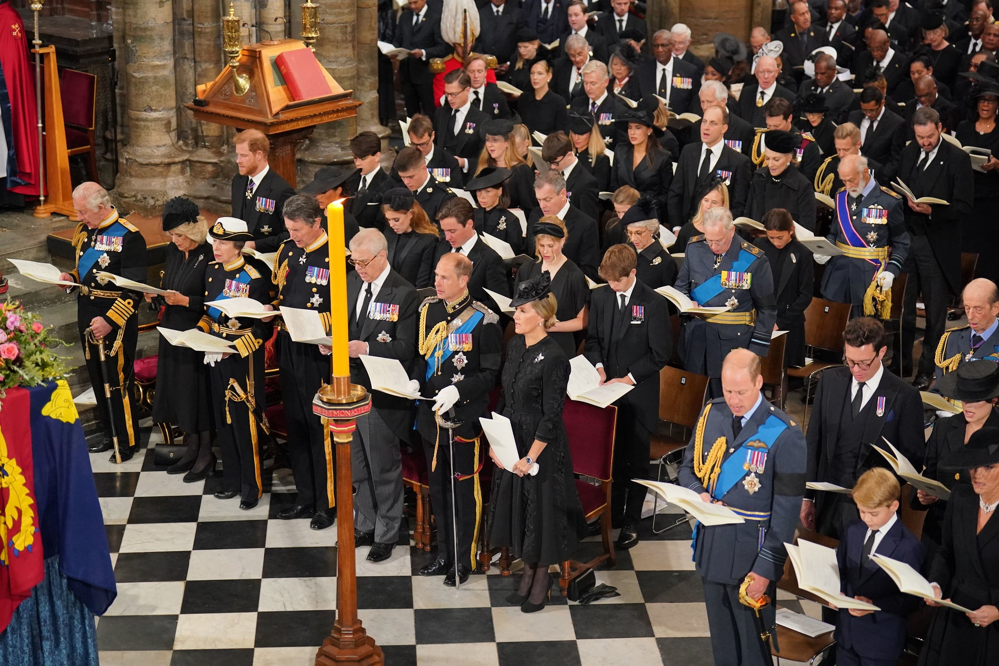 LONDON, ENGLAND - SEPTEMBER 19: (front row L-R) King Charles III, Camilla, Queen Consort, Princess Anne, Princess Royal, Vice Admiral Sir Timothy Laurence, Prince Andrew, Prince Edward, Earl of Wessex, Sophie, Countess of Wessex, (second row L-R) Prince Harry, Duke of Sussex, the Duchess of Sussex, Princess Beatrice, Edoardo Mapelli Mozzi and Lady Louise Windsor, (third row L-R) Samuel Chatto, Arthur Chatto, Lady Sarah Chatto and Daniel Chatto in front of the coffin of Queen Elizabeth II during the State Funeral of Queen Elizabeth II, held at Westminster Abbey, on September 19, 2022 in London, England.  Elizabeth Alexandra Mary Windsor was born in Bruton Street, Mayfair, London on 21 April 1926. She married Prince Philip in 1947 and ascended the throne of the United Kingdom and Commonwealth on 6 February 1952 after the death of her Father, King George VI. Queen Elizabeth II died at Balmoral Castle in Scotland on September 8, 2022, and is succeeded by her eldest son, King Charles III. (Photo by Dominic Lipinski - WPA Pool/Getty Images)