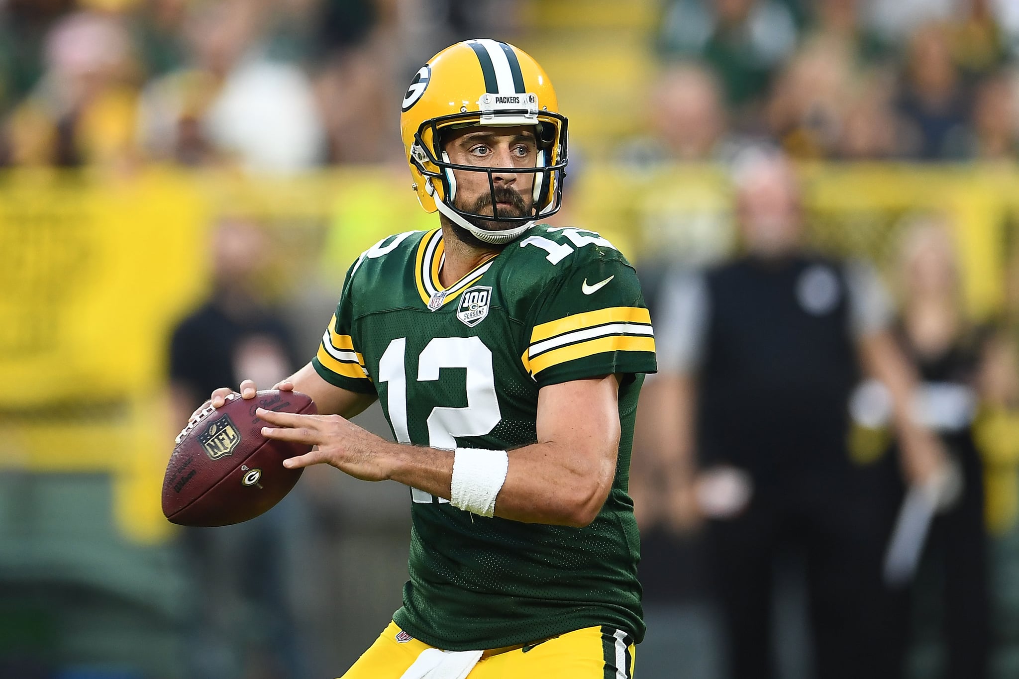 GREEN BAY, WI - AUGUST 16:  Aaron Rodgers #12 of the Green Bay Packers drops back to pass during a preseason game against the Pittsburgh Steelers at Lambeau Field on August 16, 2018 in Green Bay, Wisconsin.  The Packers defeated the Steelers 51-34.  (Photo by Stacy Revere/Getty Images)