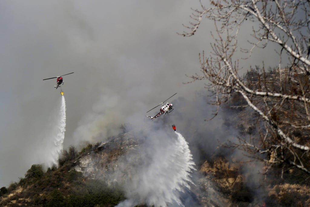 Helicopters worked to control the flames.
