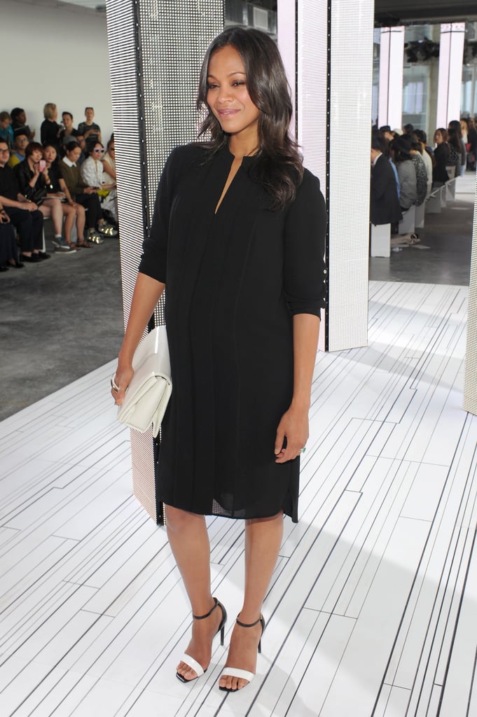 Zoe Saldana showed off her growing baby bump at the Boss fashion show on Wednesday.