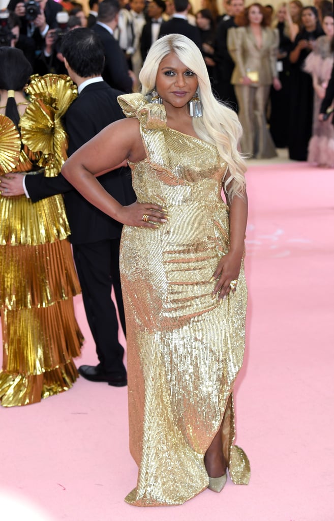 For the "Camp: Notes on Fashion"-themed Met Gala in 2019, Kaling was golden in Moschino with a platinum-blond hairstyle; oversize, mirror-effect chandelier earrings; and glitter pumps.