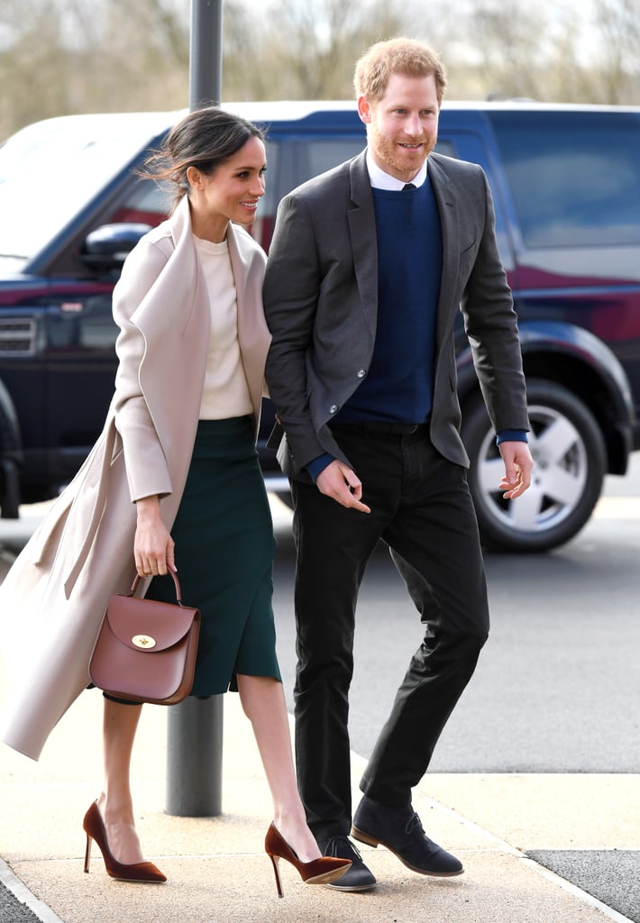 Prince Harry opted for a blue sweater when he visited Northern Ireland with Meghan, who wore a gorgeous neutral outfit with a splash of color.