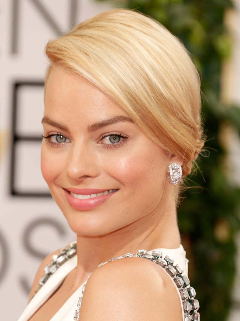 Margot Robbie accessorized with major diamond earrings.