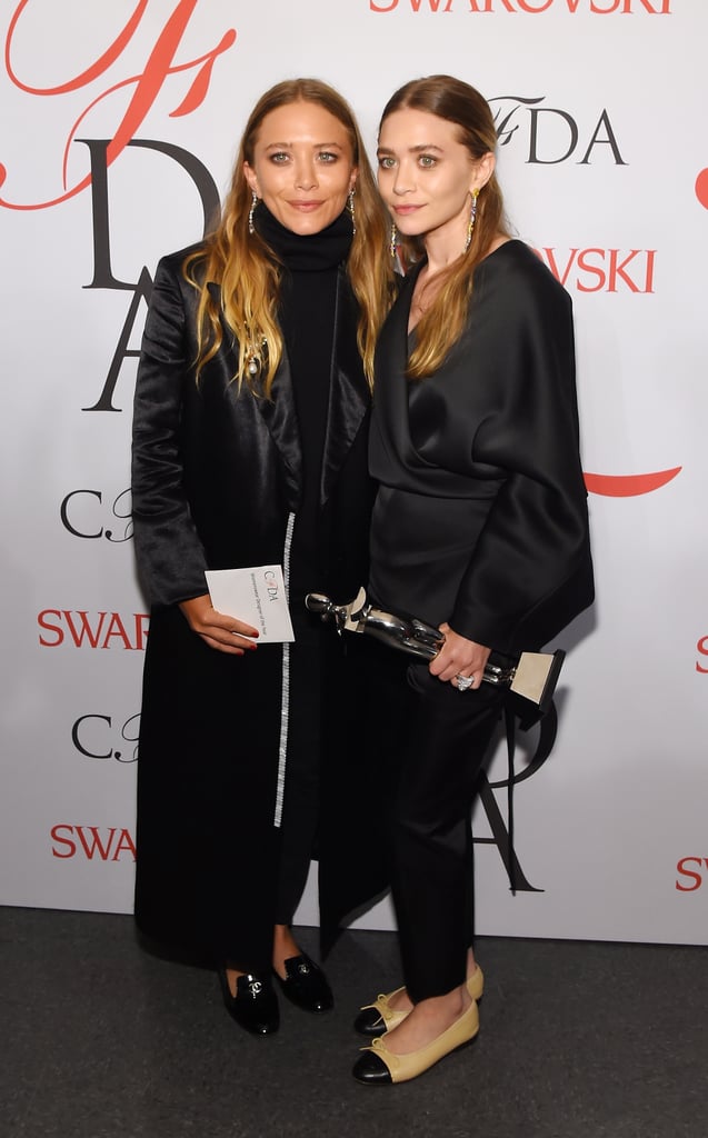 Twinning combo: The duo donned what they called "f*ck it flats" while accepting their award for womenswear designers of the year at the 2015 CFDA Awards.

Ashley paired her Chanel flats with silky separates.
Mary-Kate kept her style cozy in Chanel loafers, black turtleneck, and long coat.