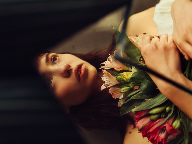 Woman Holding Bouquet of Flowers