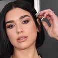 Dua Lipa Wore a Sleek Black Catsuit Covered in Teardrop Cutouts (and Holographic Slides!)
