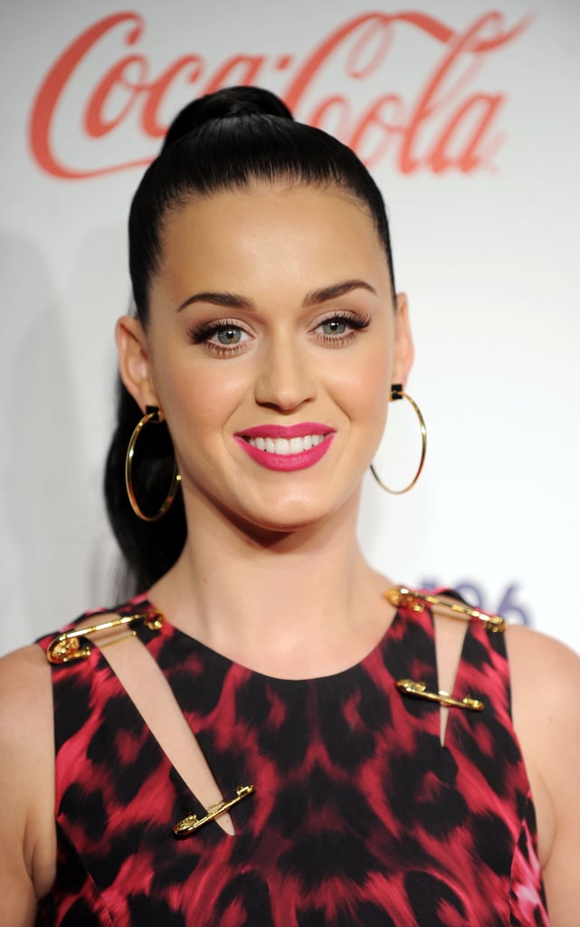 Katy Perry attended the London Jingle Ball with a high ponytail that flowed down her back. The slicked-back look made plenty of room for her pink lip to stand out.