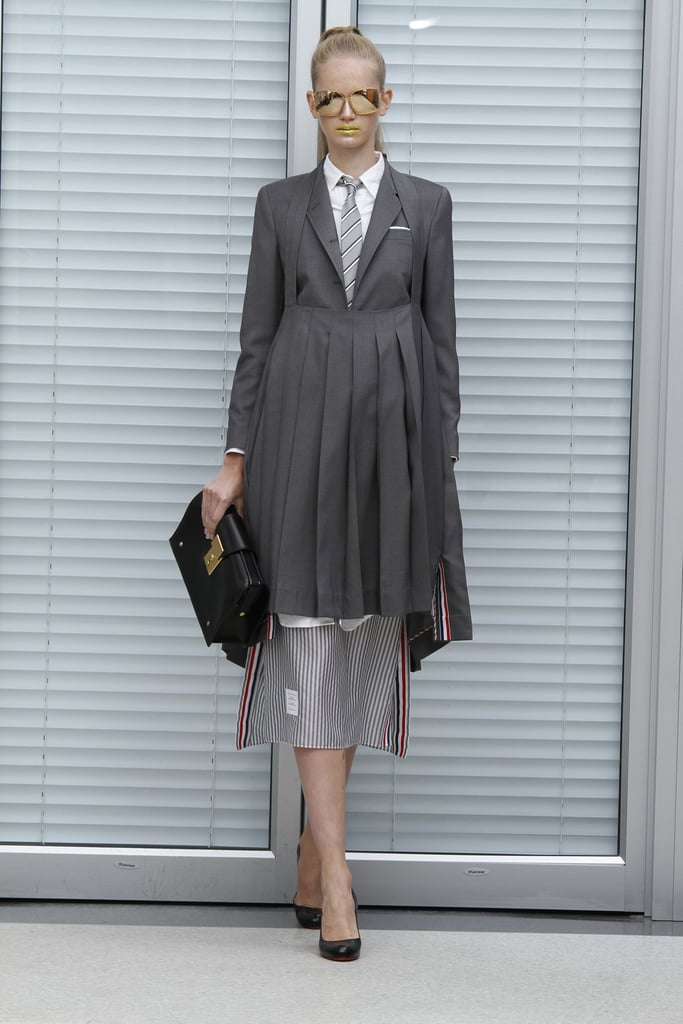 >> Thom Browne announced earlier this year that he's making an official foray into womenswear: “I want to develop it the same way men’s developed — small at first, and evolving slowly.” Which means that his Spring 2011 collection — the first full pictures of which have just surfaced — debuted under the radar, save for the closeups Tommy Ton posted at the beginning of the month.
The collection is just as Browne promised: “It’s very focused on jackets and trousers and outerwear. I think it’s what people expect from me, very men’s-inspired women’s clothing. Gray flannel, navy cashmere. Good, all-American men’s wear influence, but fitting in a cool feminine way. I want it to be very understandable. Personally, when I see it on the girls I think it looks so good. I like the idea of men’s tailoring on girls. It’s very strong and sexy in a nonovert way.”
Browne's plan is to have his womenswear become "a fully developed collection . . . in the next couple seasons.” And he's already got a full runway show planned during New York Fashion Week in February for Fall 2011.