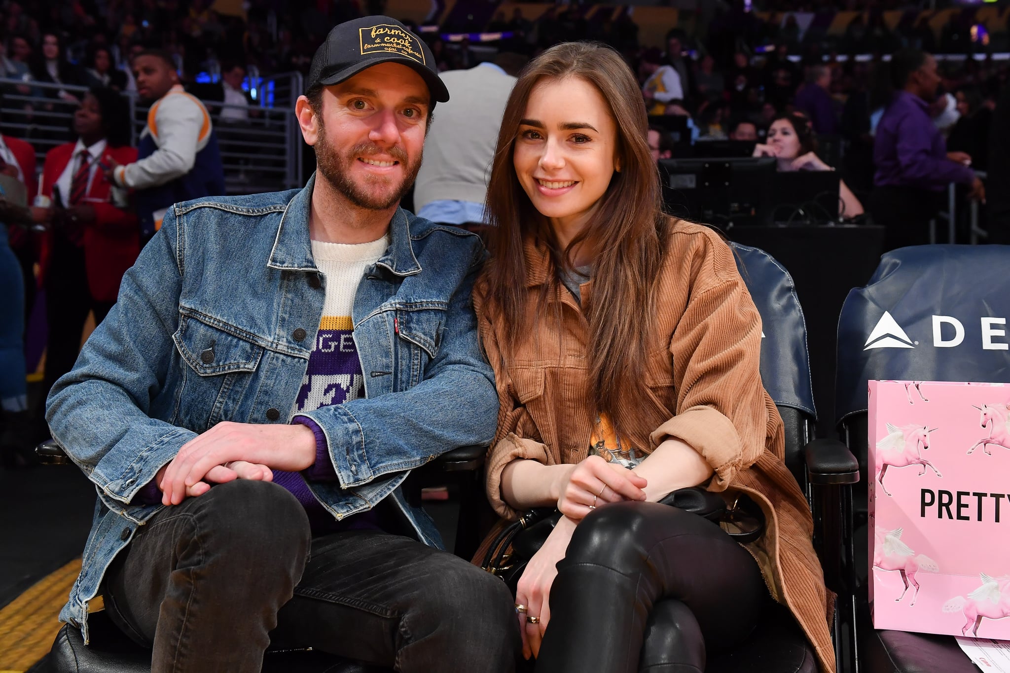 LOS ANGELES, CALIFORNIA - JANUARY 13: Lily Collins and Charlie McDowell attend a basketball game between the Los Angeles Lakers and the Cleveland Cavaliers at Staples Centre on January 13, 2020 in Los Angeles, California. (Photo by Allen Berezovsky/Getty Images)