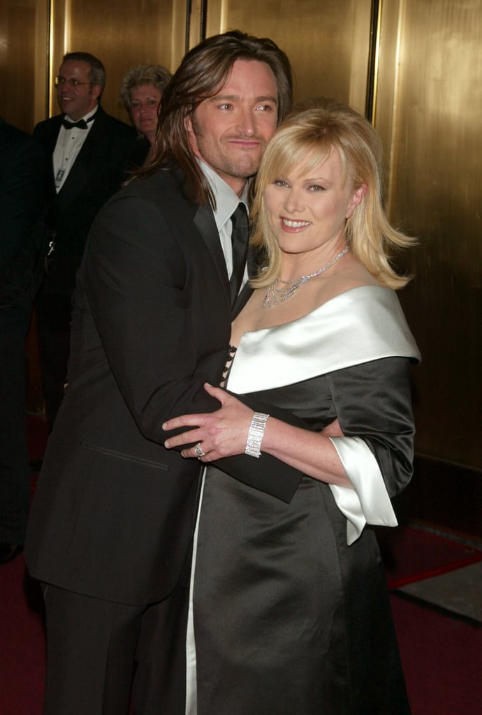 Hugh playfully hugged his wife during the Tony Awards in June 2003.