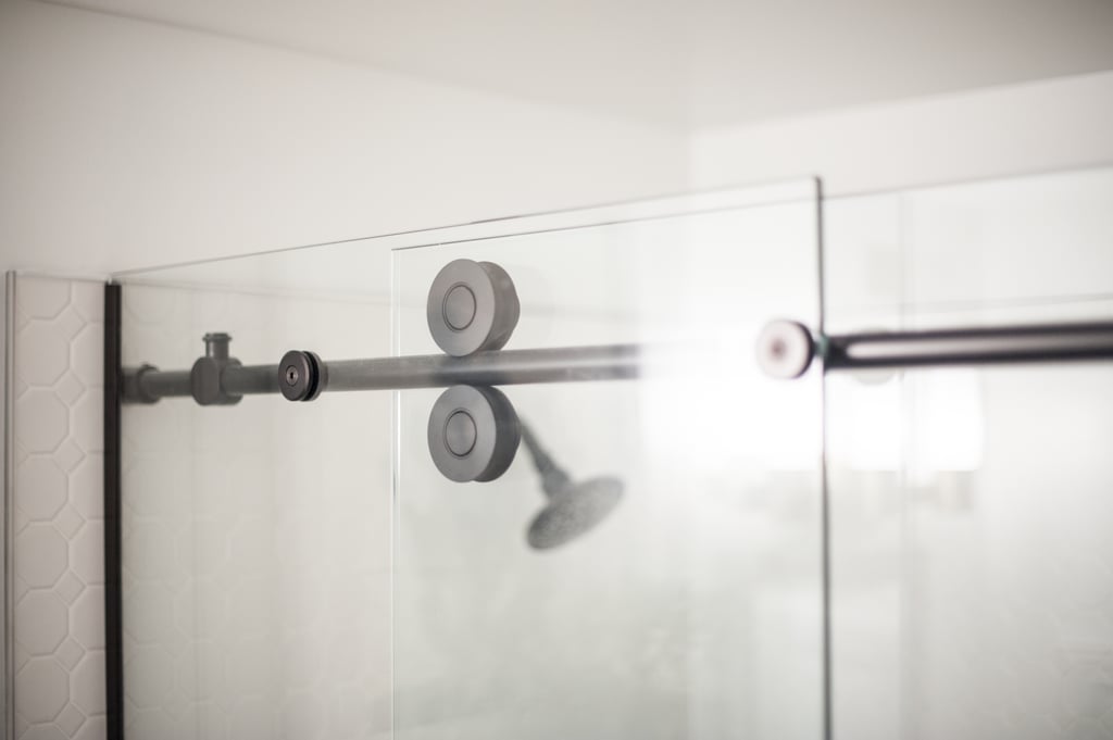 You don't need to rely on pricey specialty stores to access high-design features. Lowe's actually carries a ton of superstylish options, like this cool shower with rolling sliders. Sort of the modern equivalent to sliding barn doors.