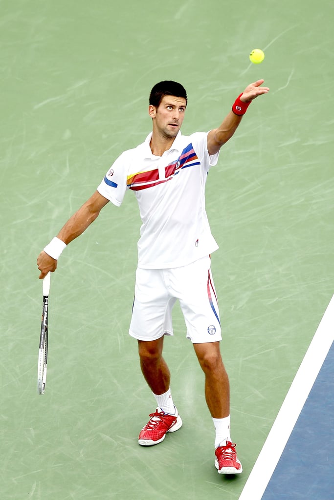 Novak Djokovic paired red tennis shoes with a cool striped shorts and polo shirt combo at the Western & Southern Open in Ohio in August 2011.