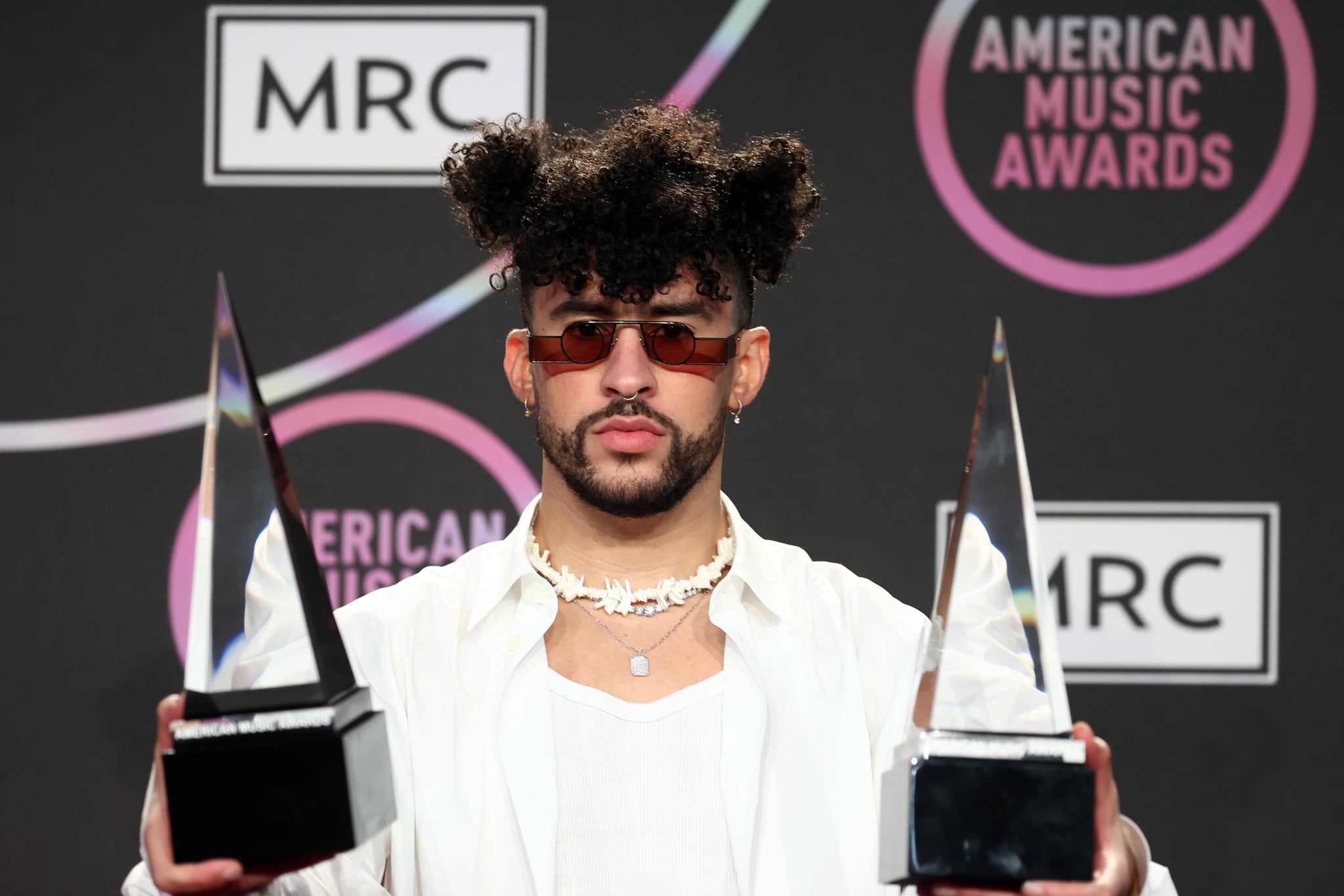 LOS ANGELES, CALIFORNIA - NOVEMBER 21: Bad Bunny, winner of the Favorite Male Latin Artist award, poses in the press room at the 2021 American Music Awards at Microsoft Theater on November 21, 2021 in Los Angeles, California. (Photo by Matt Winkelmeyer/Getty Images for MRC)