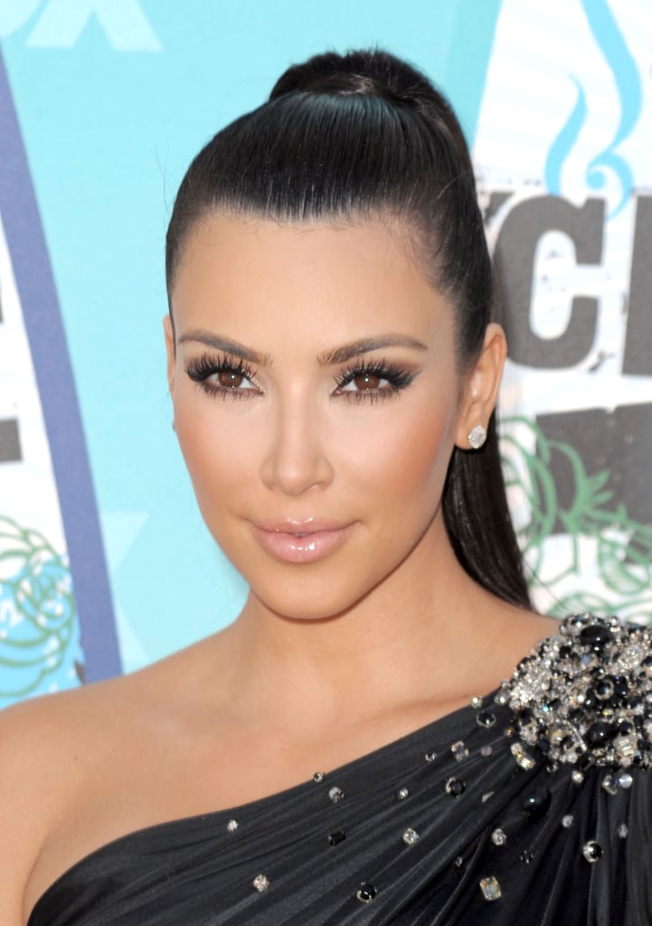 In 2010, she attended the Teen Choice Awards with a glossy, pale nude pout that directed all the attention to Kim's lush lashes.