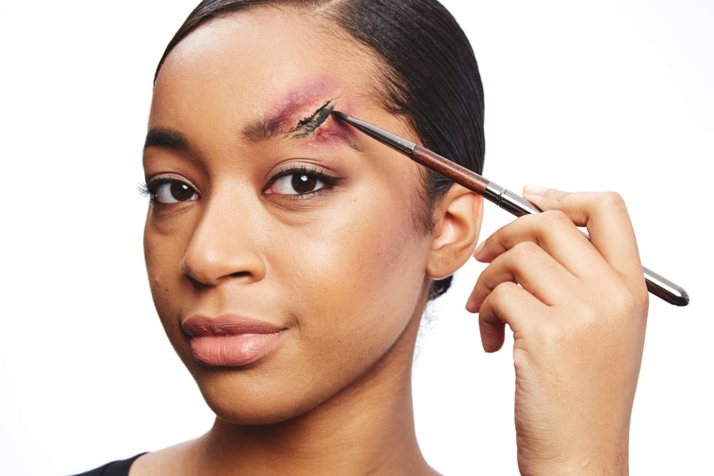 Fill in the inside of the wound with black eyeliner using a lip brush. The black will add a deeper, dried-blood appearance to the wound, making it look more realistic.