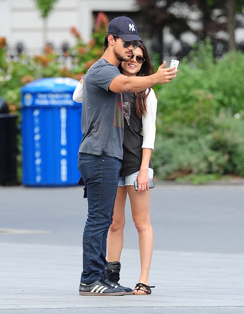 Taylor Lautner took a photo of himself with new girlfriend Marie Avgeropoulos in NYC in July 2013.