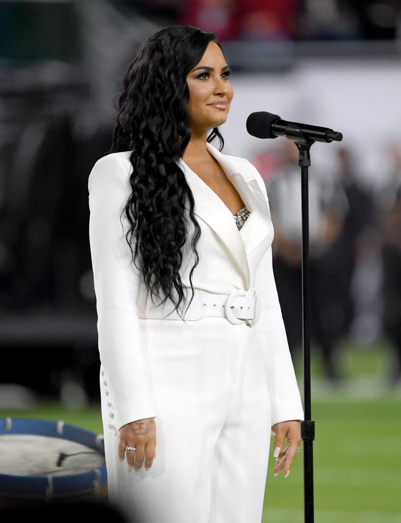 Demi Lovato's White Sergio Hudson Jumpsuit at the Super Bowl