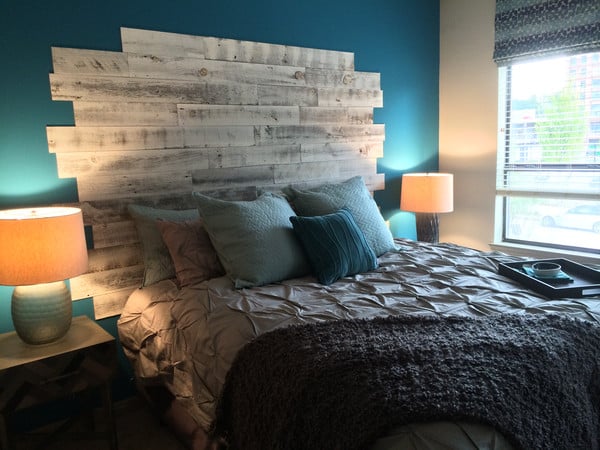 Wood planks along the wall are a perfect headboard alternative.