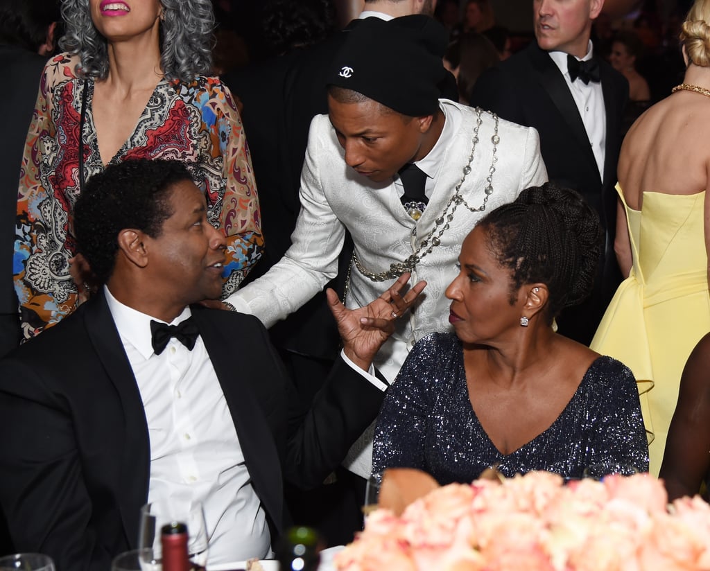 Pictured: Denzel Washington, Pauletta Washington, and Pharell Williams