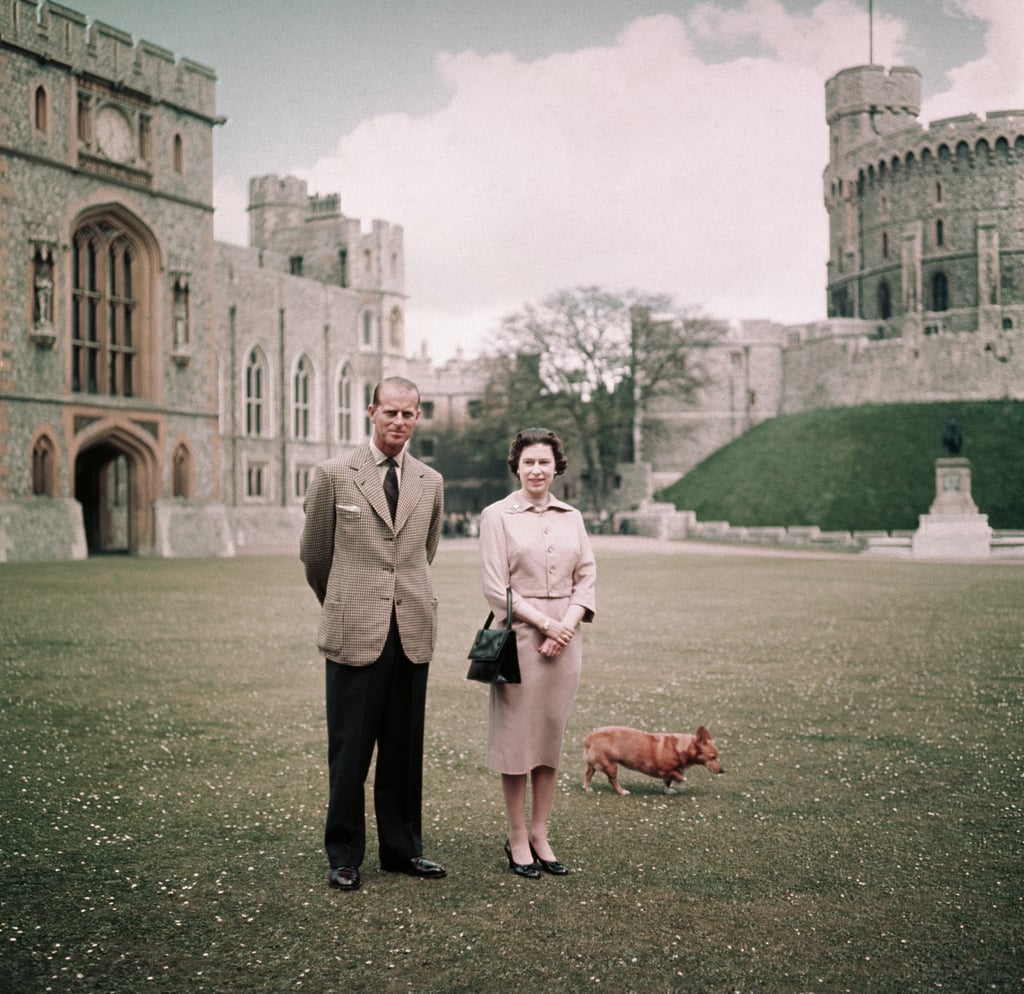 Queen Elizabeth II, Prince Philip, and one of their corgis at Windsor Castle in 1959.