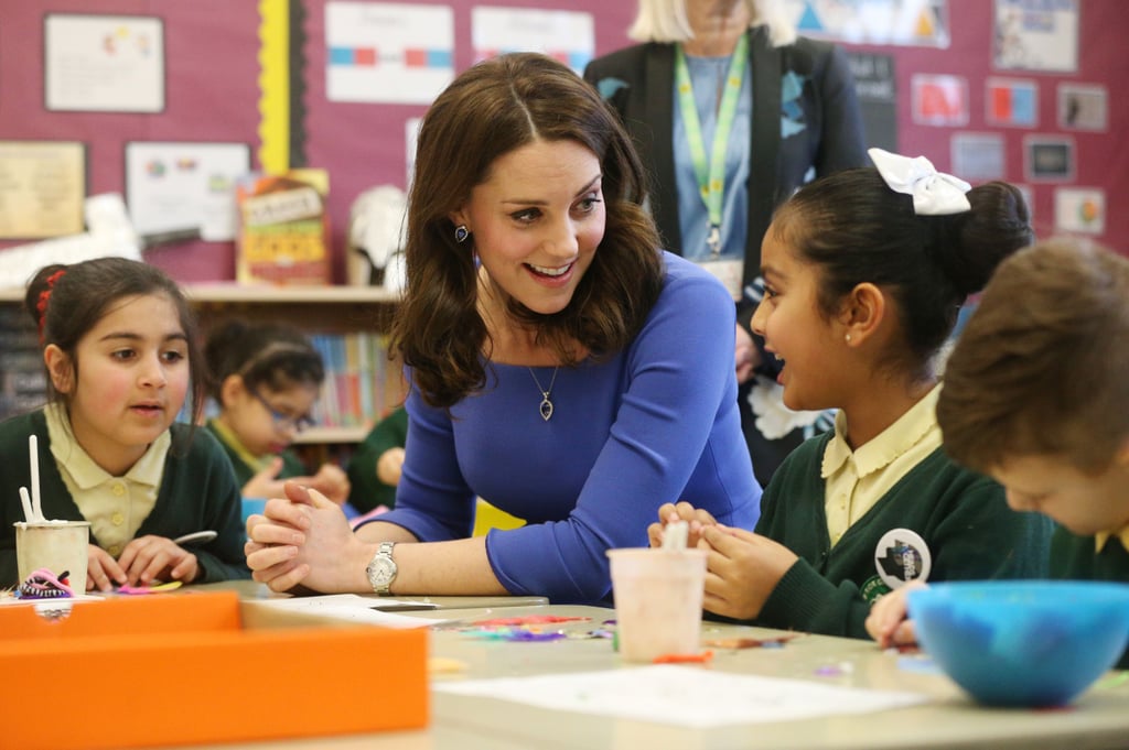 Kate engaged with a young girl during her visit to a junior high school in London in January 2018.