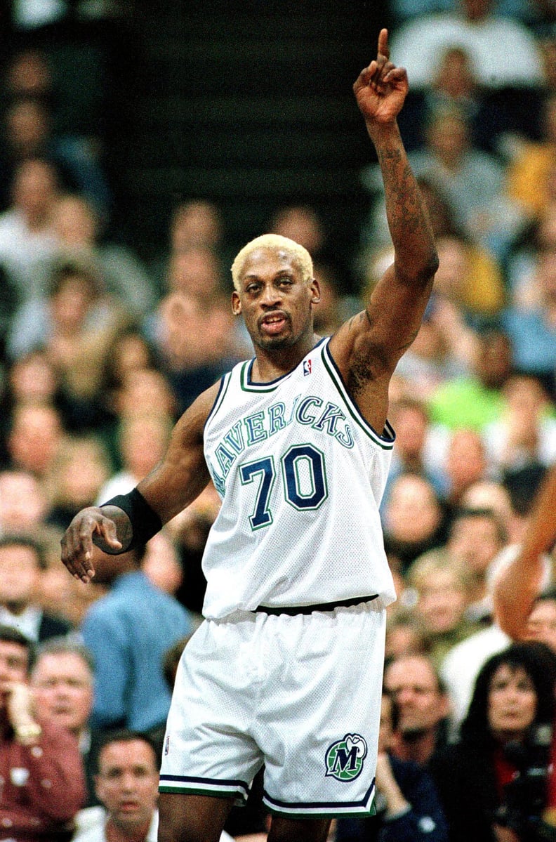 Dennis Rodman reacts to a score in his first game in a Dallas Maverick uniform versus the Seattle SuperSonics in the first quarter of action at Reunion Arena in Dallas, Texas 09 February, 2000.  AFP Photo/Paul BUCK (Photo by PAUL BUCK / AFP)        (Photo