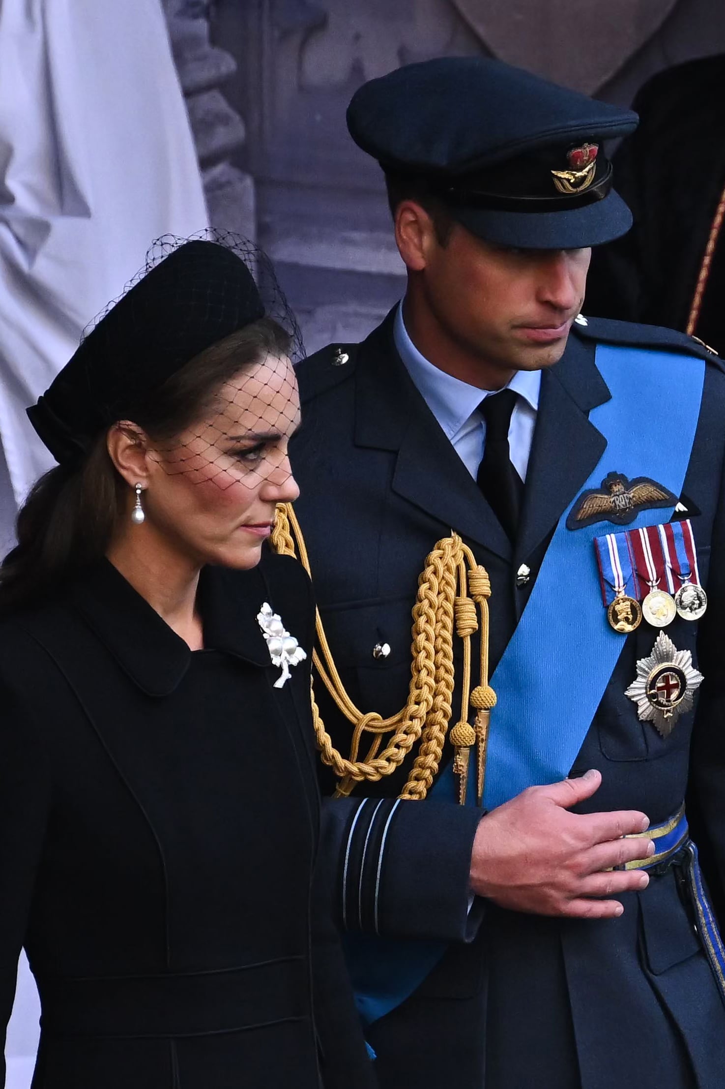 LONDON, ENGLAND - SEPTEMBER 14:  Catherine, Princess of Wales and Prince William, Prince of Wales leave after a service for the reception of Queen Elizabeth II's coffin at Westminster Hall, on September 14, 2022 in London, United Kingdom. Queen Elizabeth II's coffin is taken in procession on a Gun Carriage of The King's Troop Royal Horse Artillery from Buckingham Palace to Westminster Hall where she will lay in state until the early morning of her funeral. Queen Elizabeth II died at Balmoral Castle in Scotland on September 8, 2022, and is succeeded by her eldest son, King Charles III. (Photo by Ben Stansall - WPA Pool/Getty Images)