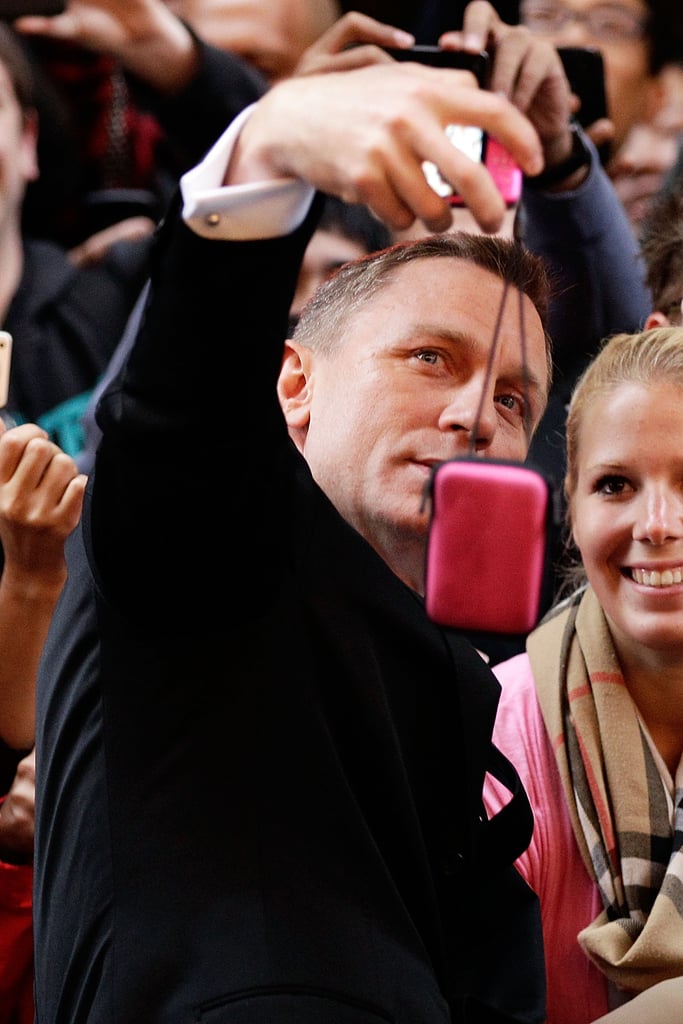Daniel Craig held onto a camera for a fan while at an event in Australia in November 2012.