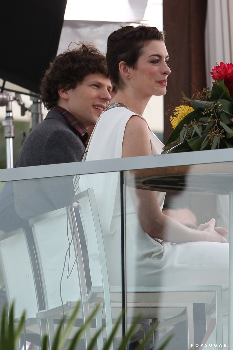 She sat with costar Jesse Eisenberg.