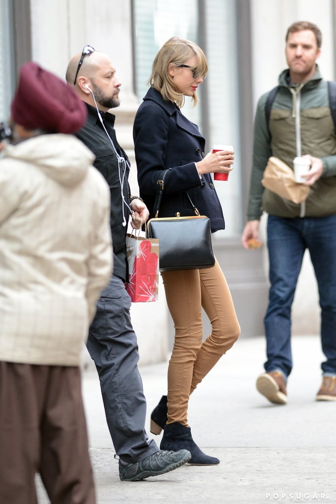 Taylor Swift had her coffee handy in NYC on Friday.