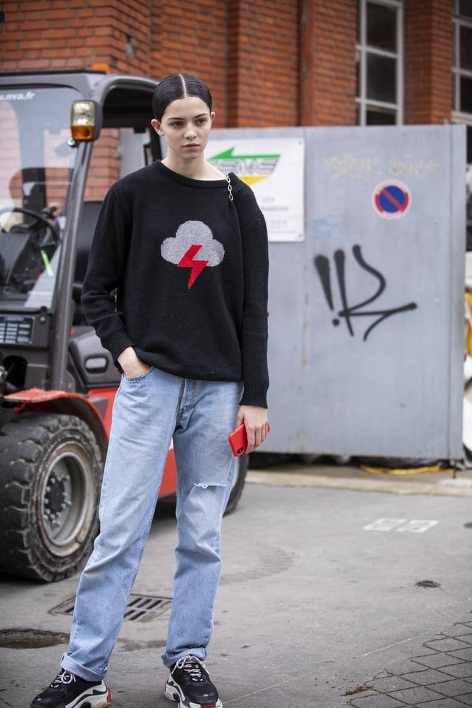 Style a cozy sweater with jeans and sneakers.