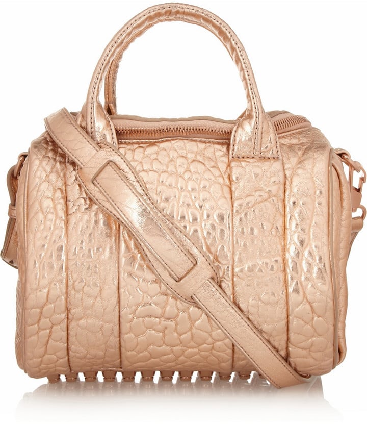 Gym bags really aren't her thing; she'd rather stuff her gear in a must-have bag, like this Alexander Wang Rockie Dumbo Metallic Textured-Leather Tote ($875).