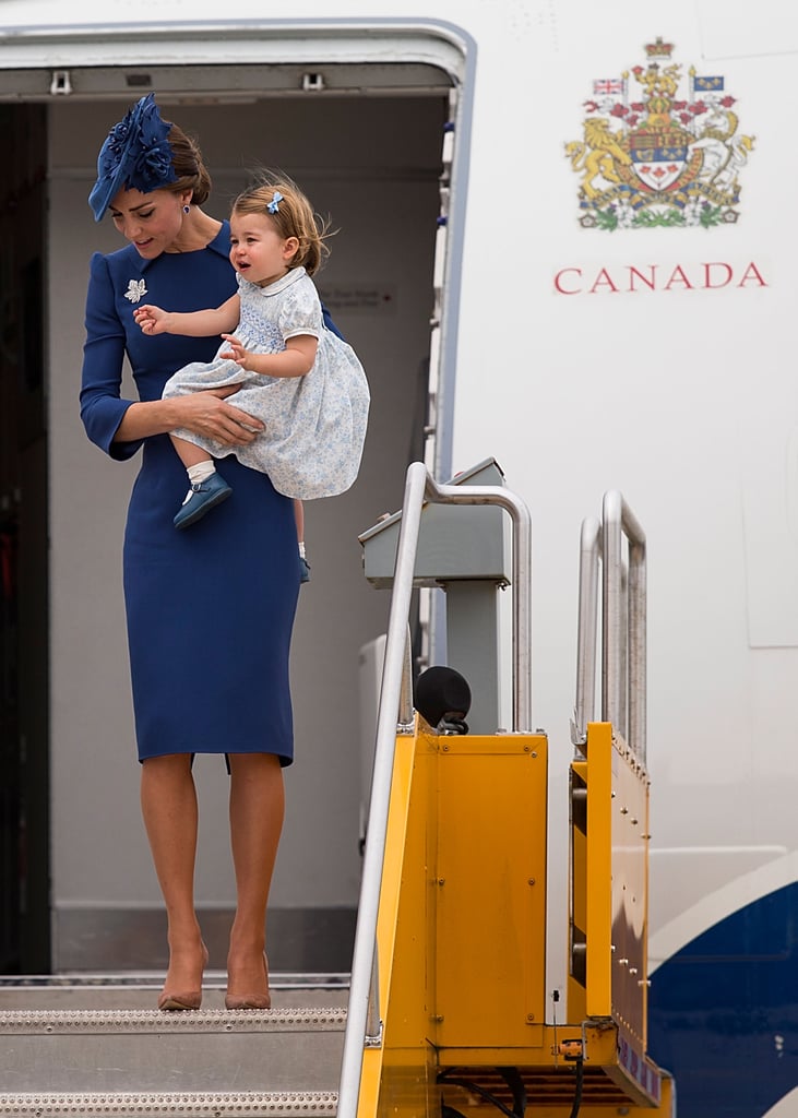 Kate touched down in Canada looking impeccably polished in a blue sheath Jenny Packham dress and coordinating Sylvia Fletcher fascinator.
