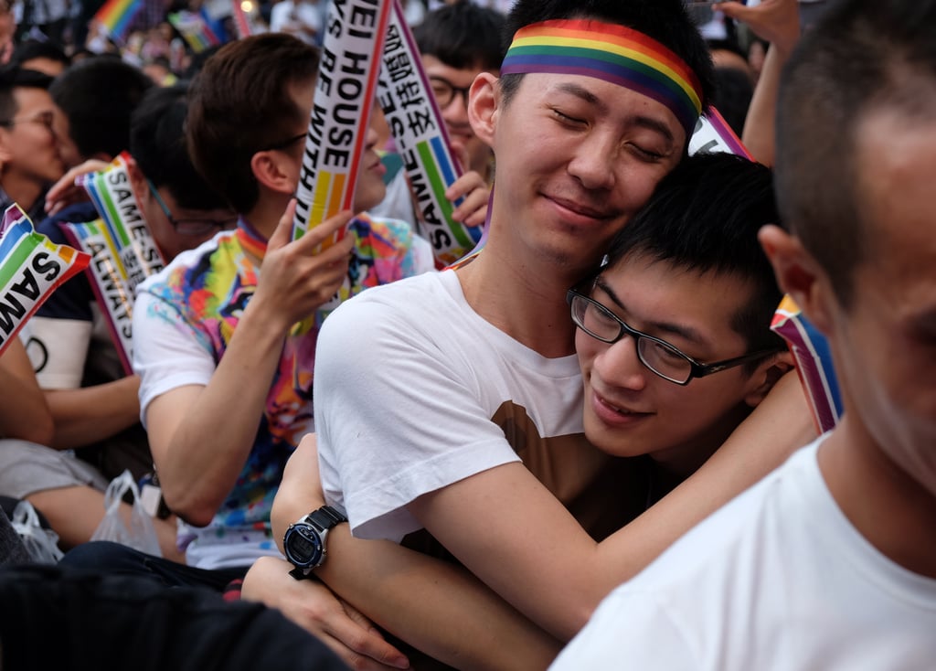 Two people hug after hearing the court rule in favor of legalizing gay marriage.