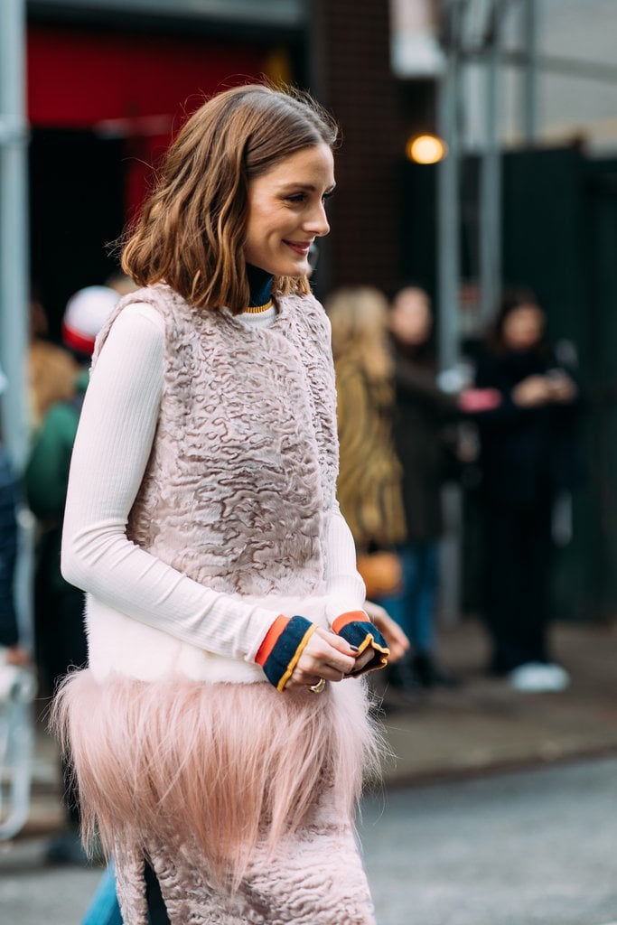 As she made her way to the Self-Portrait show, Olivia rocked a showstopping Cara Mila furry vest.