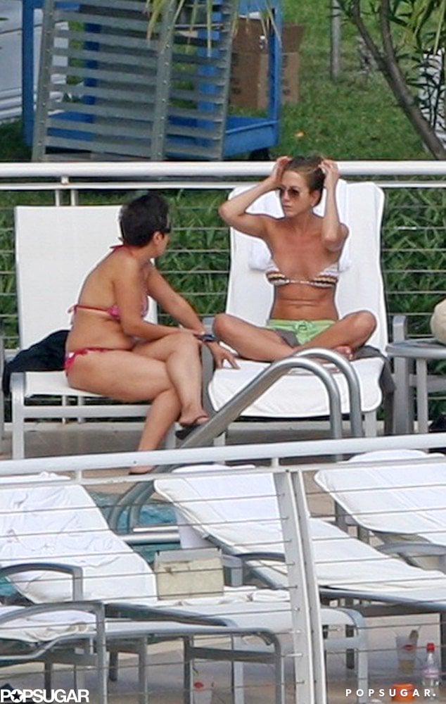 Jennifer chatted with a friend on a lounge chair in Miami in May of 2008.