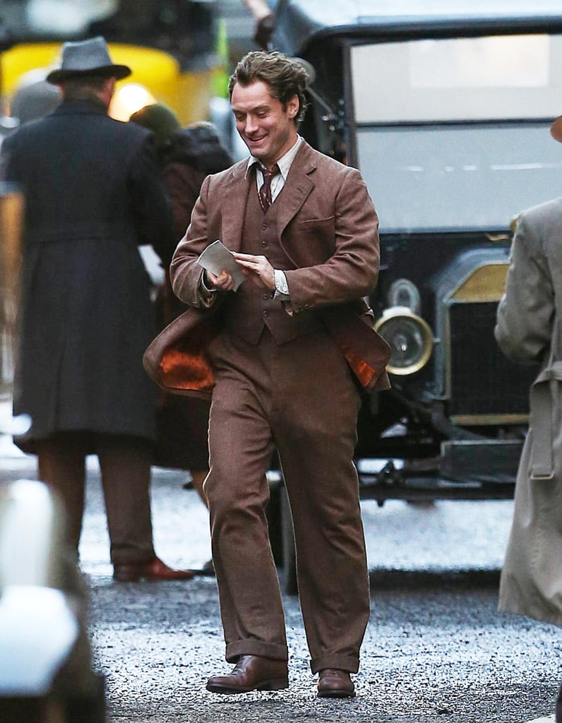 Jude Law had a pep in his step on the set of Genius in Manchester, England, on Sunday.