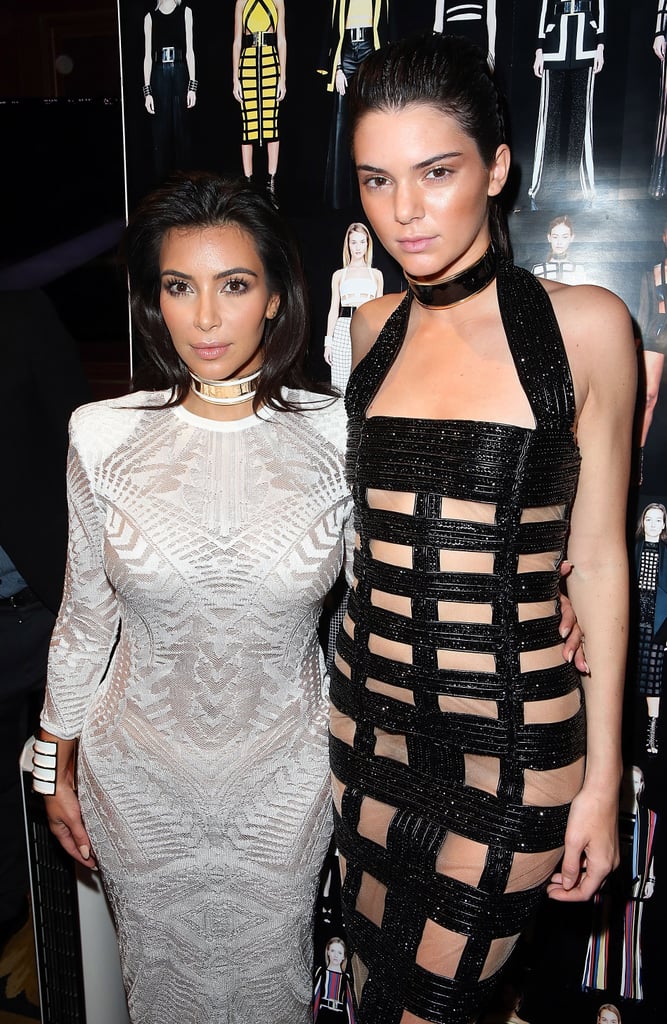 Kim and Kendall went for opposing black and white looks during the Spring 2015 show in Paris.