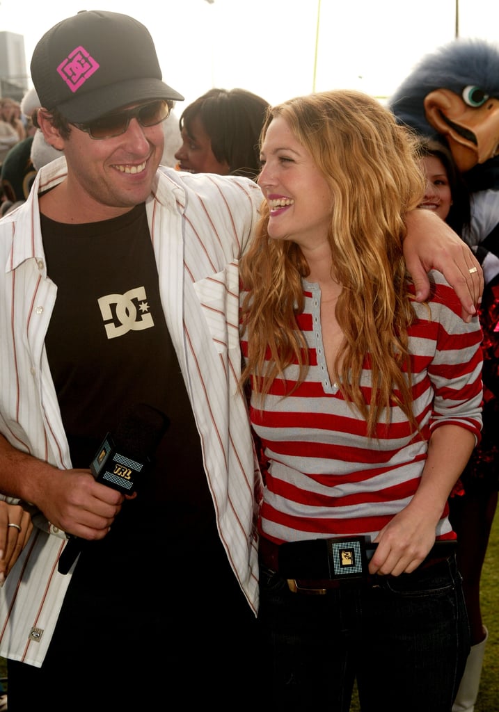 Adam Sandler and Drew Barrymore shared a laugh in Houston at MTV's TRL at Super Bowl XXXVIII in 2004.